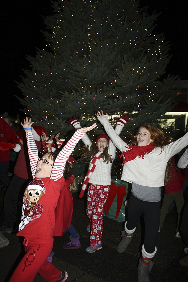Young dancers from IGNITE whirl around the newly lit North Bend Christmas tree.