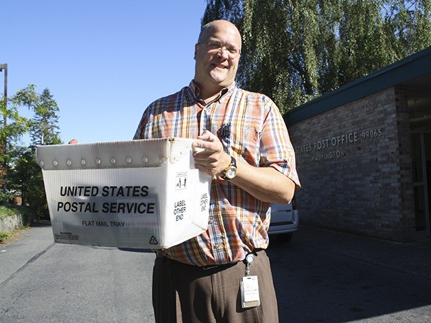Moving the mail is a 25-year career for Bjoern Gruetzmacher. The new Snoqualmie postmaster has seen change and learned much since starting as a teen clerk.