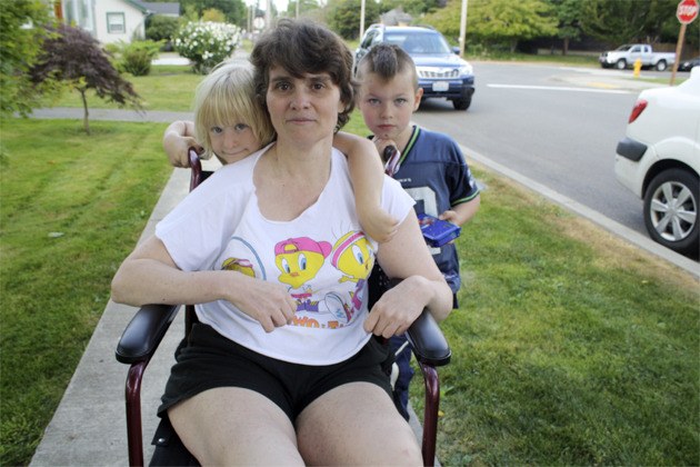 Grand-nephew and niece Elijah and Kiana Lamb help Becky Schandel of Snoqualmie stay active as she recovers from multiple sclerosis. Every time the children
