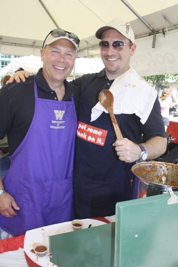 Neighbors Jim Frasier  and Tom Stankus craft ‘hillbilly chili’ at the 2012 Festival cook-off.