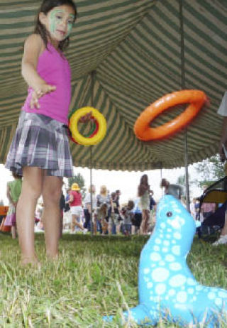Destinie Gama of Snoqualmie masters the ring toss at the June 11 Encompass Family Picnic. She is the niece of Encompass kinship-care participant Tarrah Calender. More than 250 Encompass participants and their parents and other relatives attended the annual bash at Meadowbrook Interpretive Center. Besides games