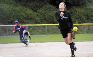 Mount Si alumnus Kandis Clesson drills one in over the plate as a player from Taiwan heads for third base
