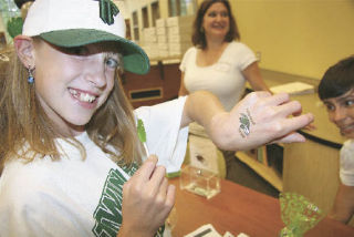 Seventh-grader Bailey Scott shows off a temporary tattoo of the Twin Falls Middle School mascot