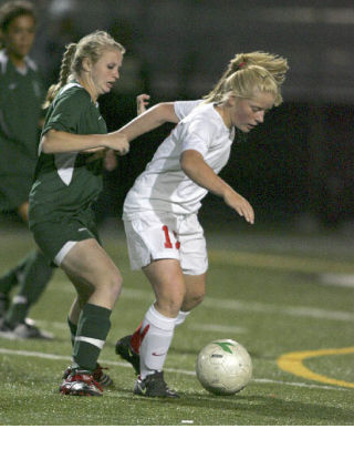 Mount Si High School’s Victoria Falcon moves around a Redmond player in last week’s game. The Wildcats played to a 0-0 tie with the Mustangs in the Tuesday