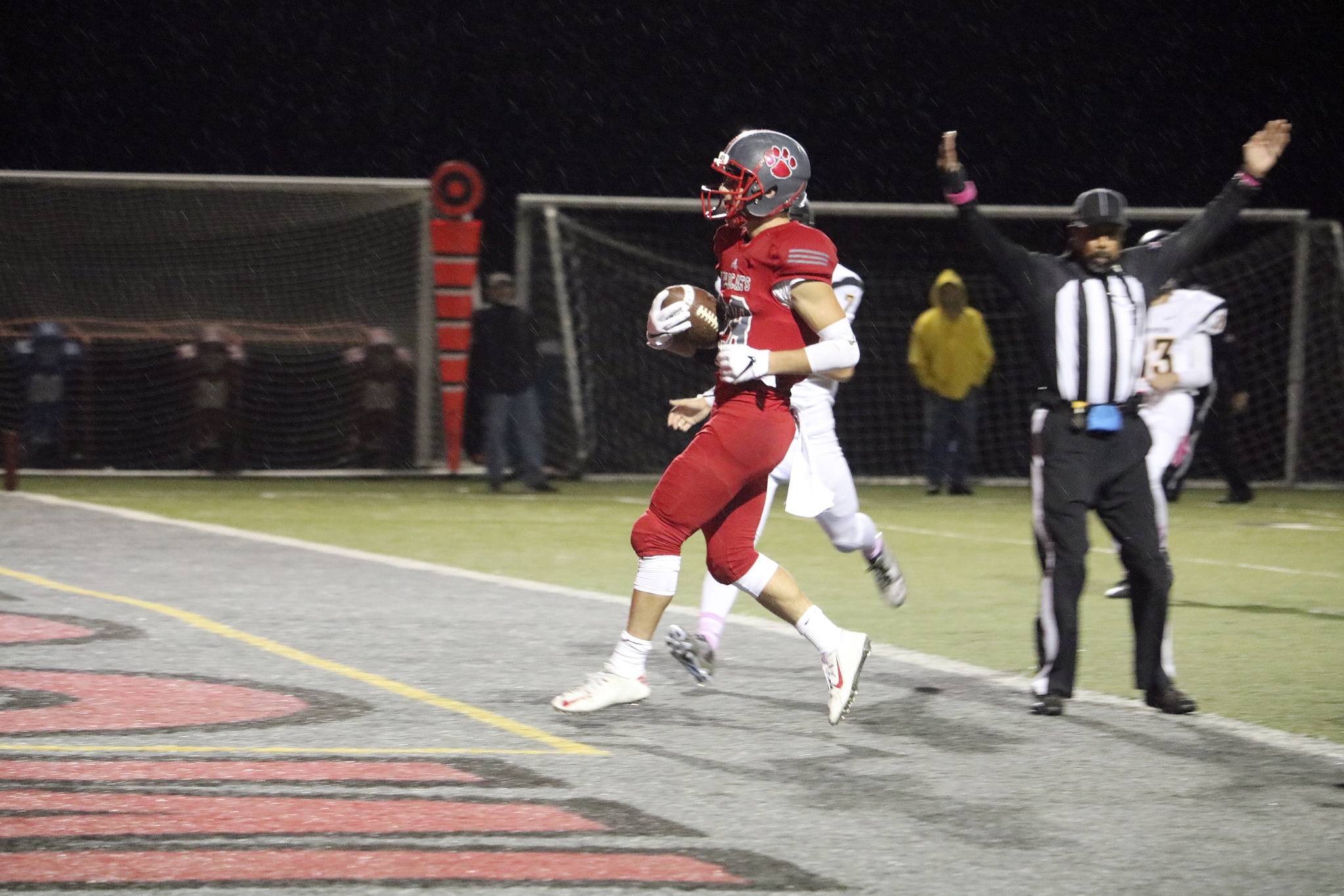 Evan Pappas/Staff Photo                                Bonda jumps into the end zone during the Homecoming game on Friday, Oct. 21 for his second touchdown of the night.