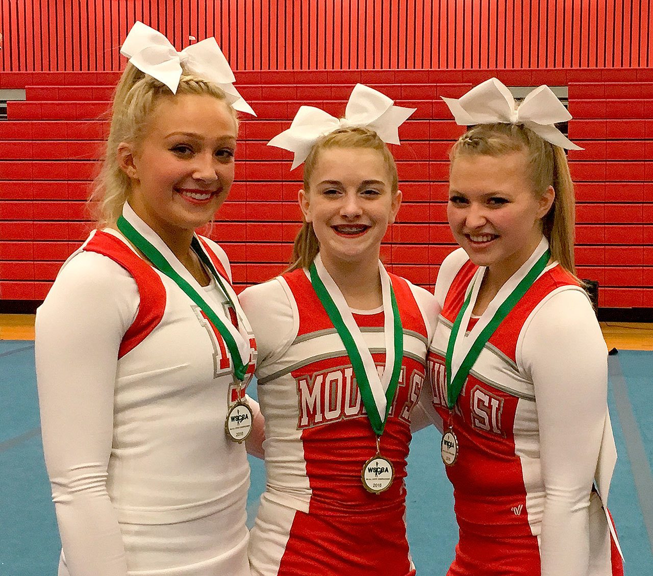 Courtesy Photo                                Mount Si Cheerleaders who were named to the All State team, pictured from left, are Halle Nicholson, Abby Mandella and Annie Bluher.