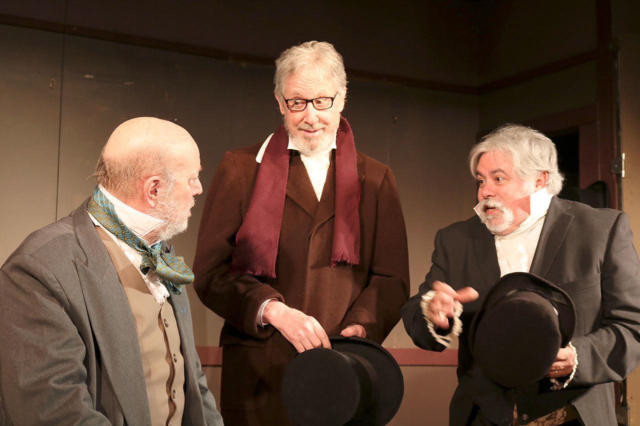 Two solicitors, played by Craig Ewing and Robert J. Lee, come to Ebenezer Scrooge asking for donations. (Evan Pappas/Staff Photo)