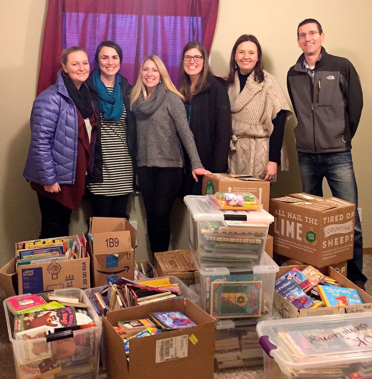 Courtesy Photo                                Participants in the book drive are, from left, Shauna Barison of the Redmond Ridge Goddard School, Erin Knox of the Snohomish Goddard School, Stephanie Doyle, Sara Farrington and Jen Paddock of Acres of Diamonds, and Jeff Barison of the Redmond Goddard School.