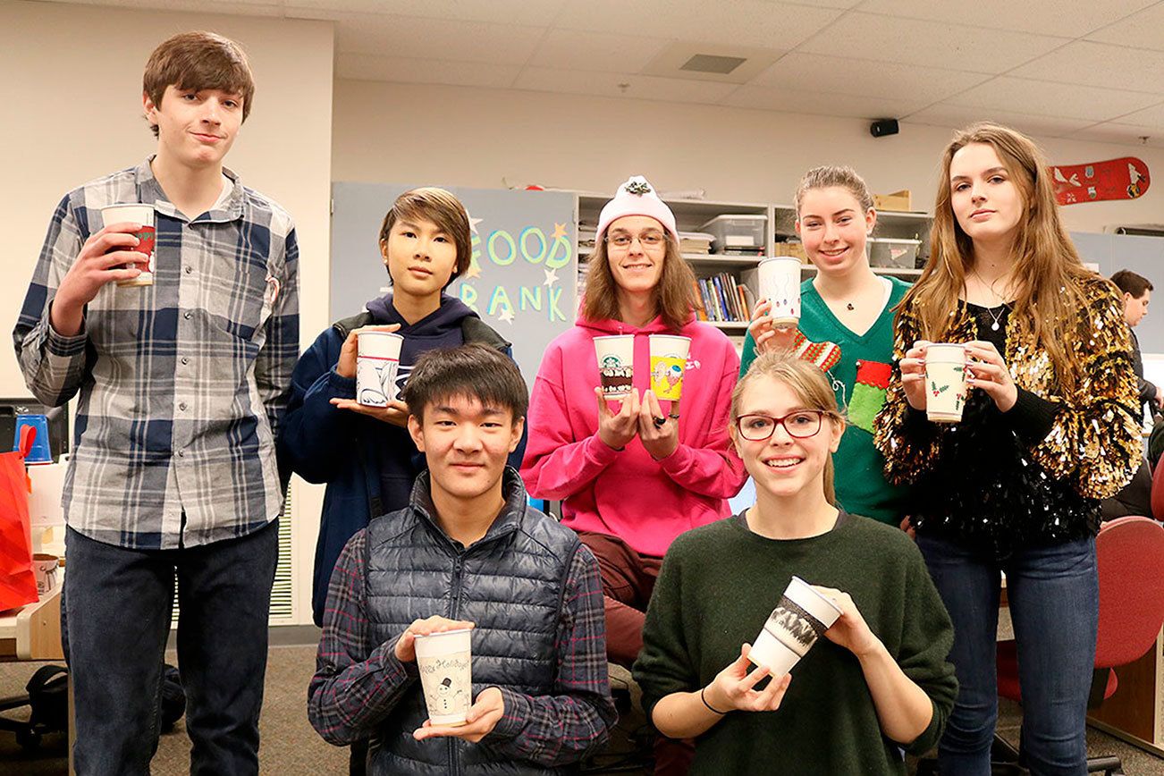 Creative student project supports food bank: Mount Si graphic designers design fundraiser coffee sleeves