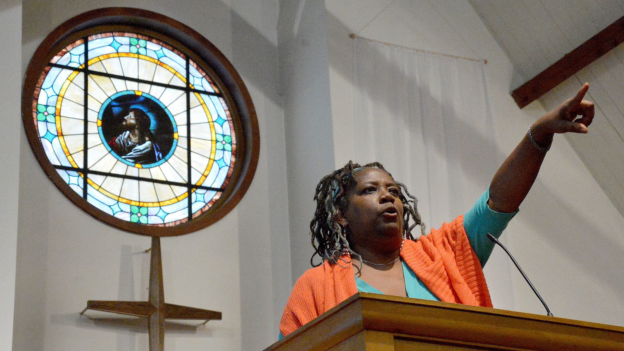 Kim Ewing, who organized the celebration of Martin Luther King Day Jan. 16, gestures dramatically during her speech at the Snoqualmie United Methodist Congregational Church.                                Mary Miller Photo