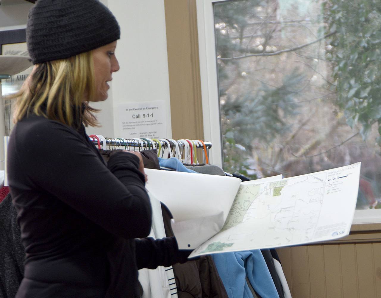 Snoqualmie Valley Winter Shelter director Jennifer Kirk uses maps for the Count Us In program to lead a volunteer orientation session at the Snoqualmie American Legion Hall, which is also a day center for the Valley’s homeless.                                Carol Ladwig/Staff Photo
