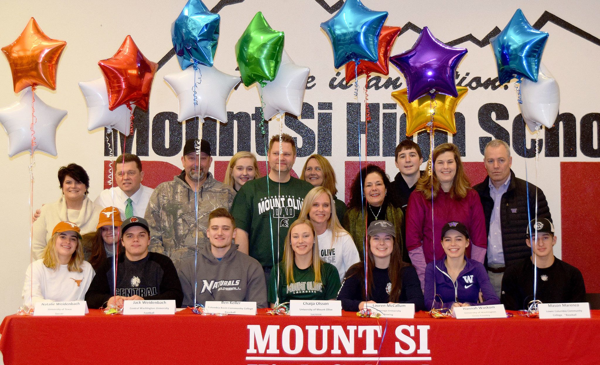 Mount Si High School athletes, along with their coaches and families, celebrated their future college scholarships Feb. 1, National Signing Day. Athletes pictured from left are Natalie Weidenbach, Jack Weidenbach, Ben Keller, Chaija Olsson, Lauren McCallum, Hannah Waskom and Mason Marenco.                                Courtesy Photo