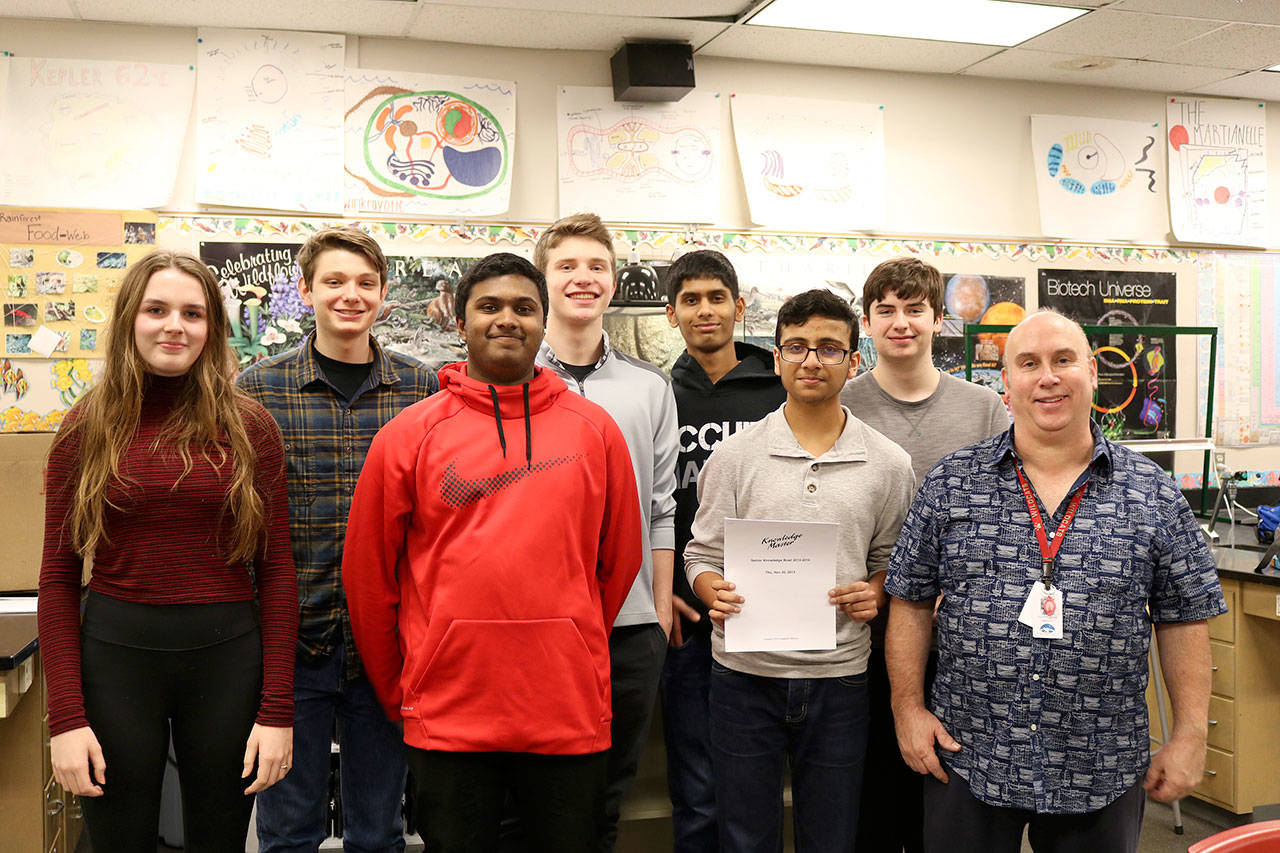 Mount Si students gathered on Monday, March 6, for Knowledge Bowl practice. From left: Lily Nordby, Preston Henning, Manjesh Puram, Noah Vaughn, Aayush Singh, Shyam Ghandi, Casey Harris, with Coach Kevin Knowles. (Evan Pappas/Staff Photo)