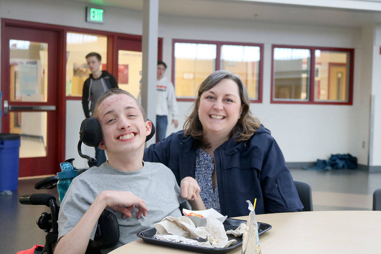 Brenna Vukovich and her student enjoy lunch at the Mount Si high School Freshman Campus. (Evan Pappas/Staff Photo)