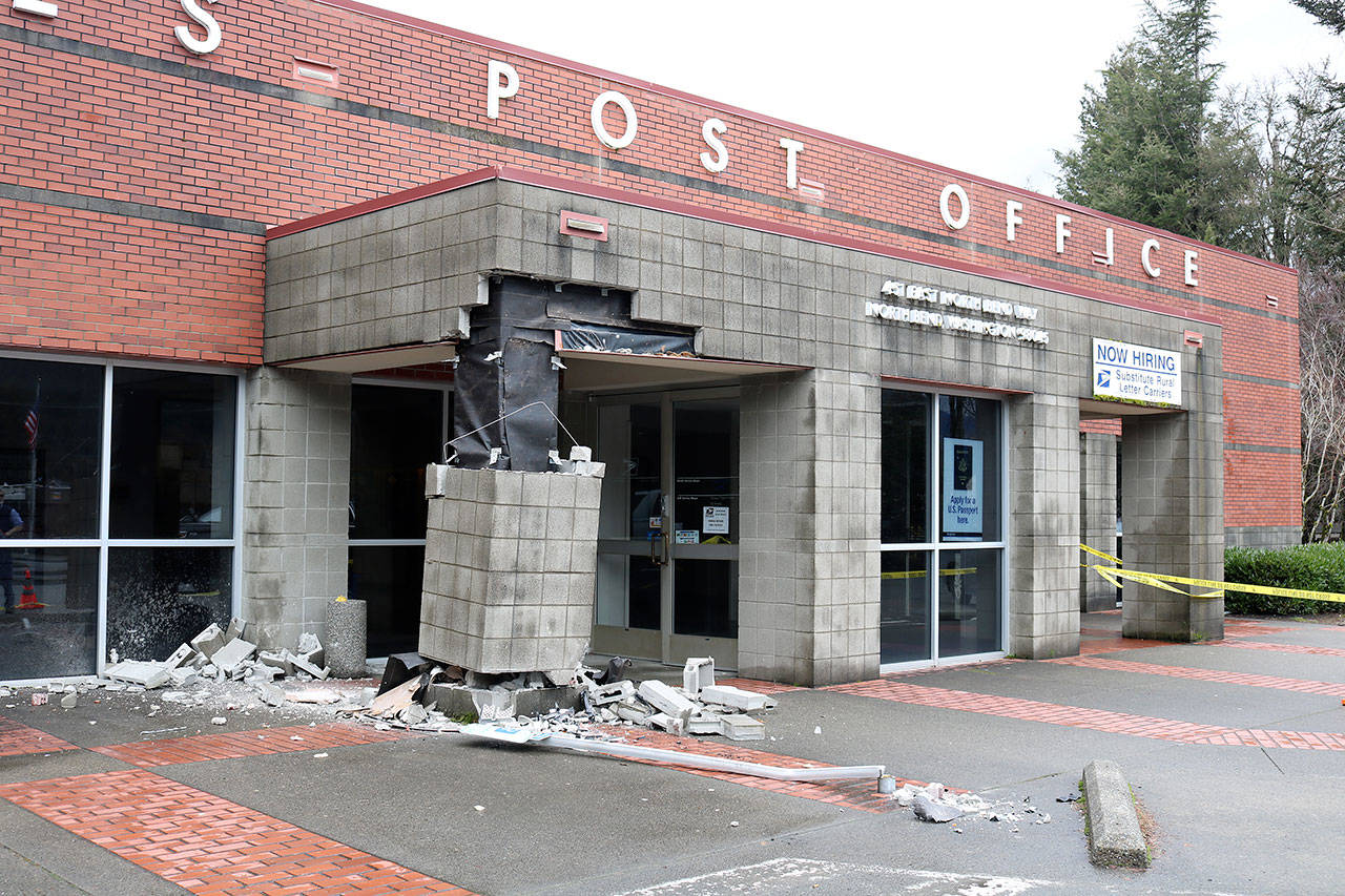 Damage to the canopy pillar at the entrance of the post office on E North Bend Way has closed the entry temporarily. (Evan Pappas/Staff Photos)