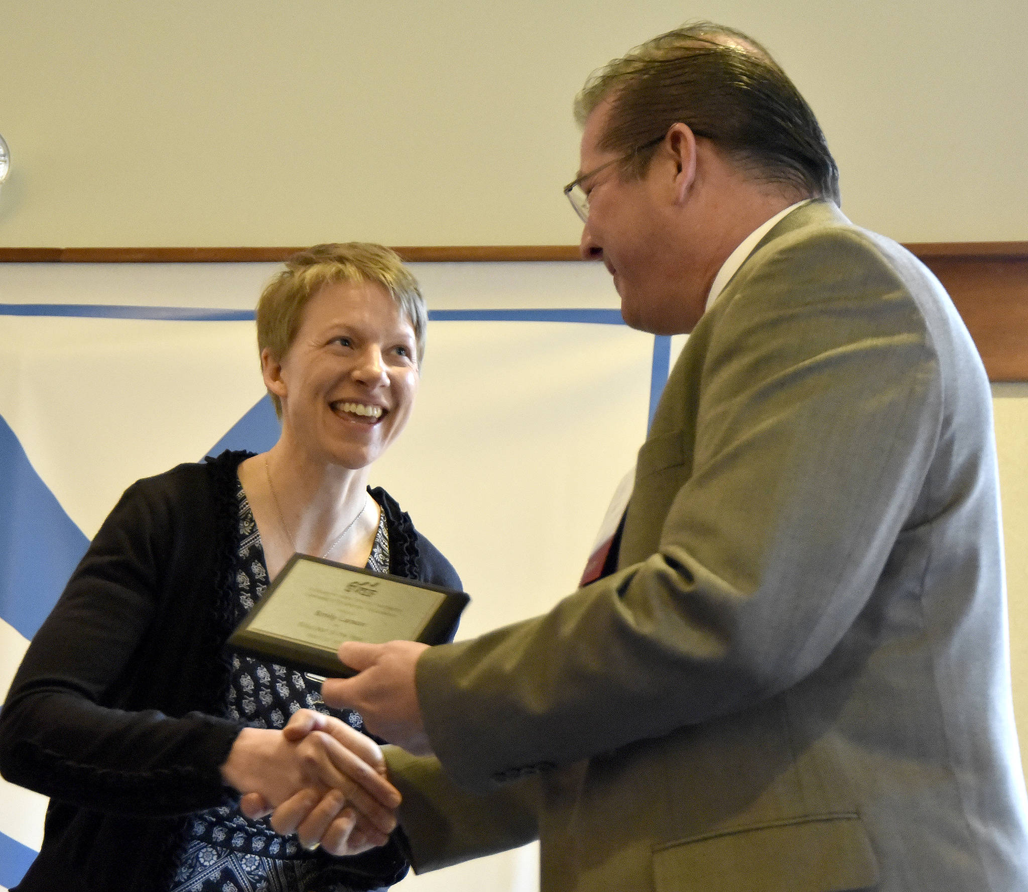 Emily Larson accepts the Elementary Educator of the Year award from Snoqualmie Valley School District Superintendent Joel Aune March 23 at the Snoqualmie Valley Schools Foundation luncheon. Carol Ladwig/Staff Photo