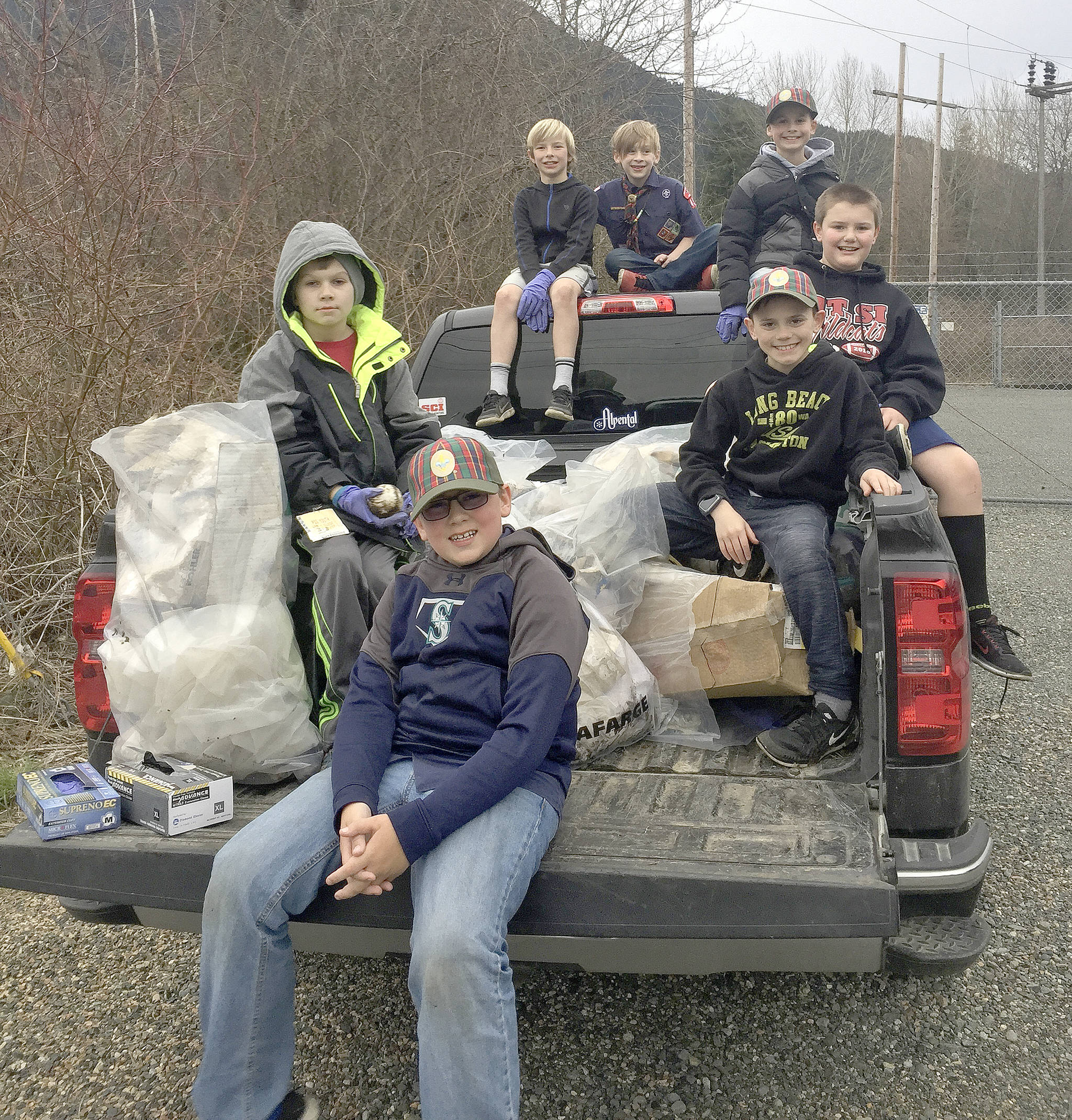 Cub Scouts of Den 3 pose for a photo after a day of cleaning up the trail.                                Courtesy Photo