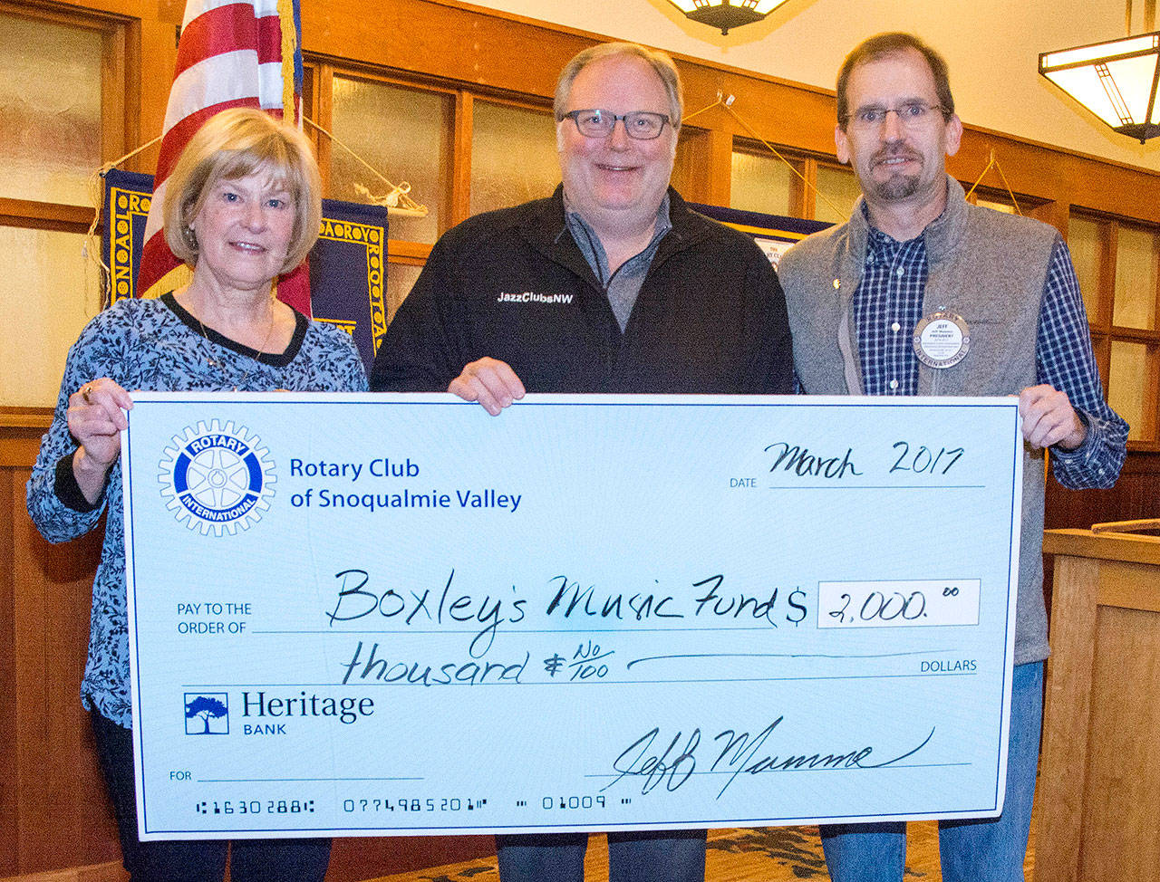Boxley Music Fund, also known as Jazz Clubs NW, was one of the community organizations to be awarded a 2017 Rotary Grant. Rotary members Nancy Whitaker, left, and President Jeff Mumma, right, presented the award to Jazz Clubs NW Executive Director Gregory Malcom March 23.                                Courtesy Photo