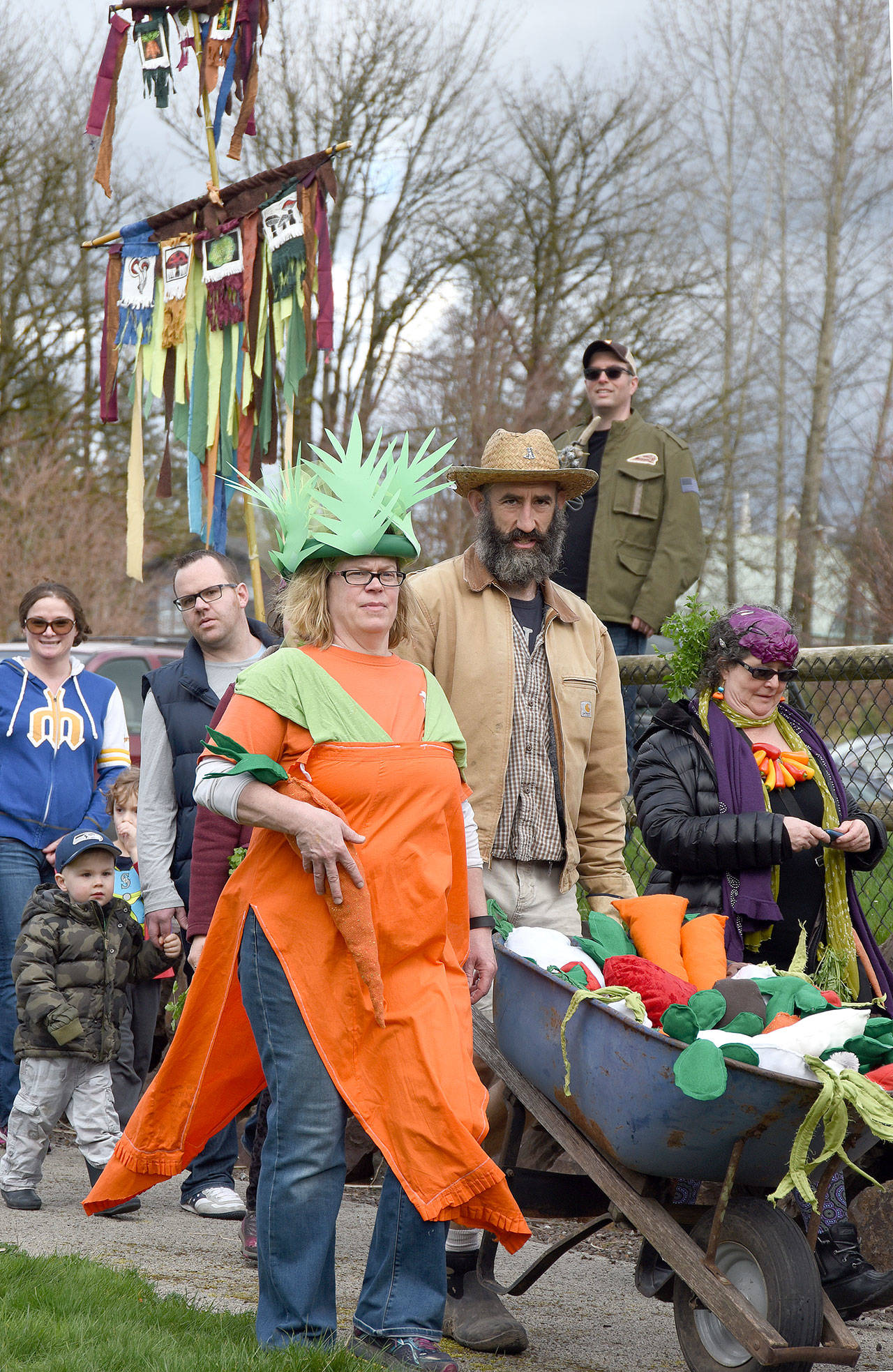 Vegetables and farmers alike marched into Duvall’s Depot Park Saturday, to conclude the March of the Vegetables parade and start the community festival that followed.                                Carol Ladwig/Staff Photo