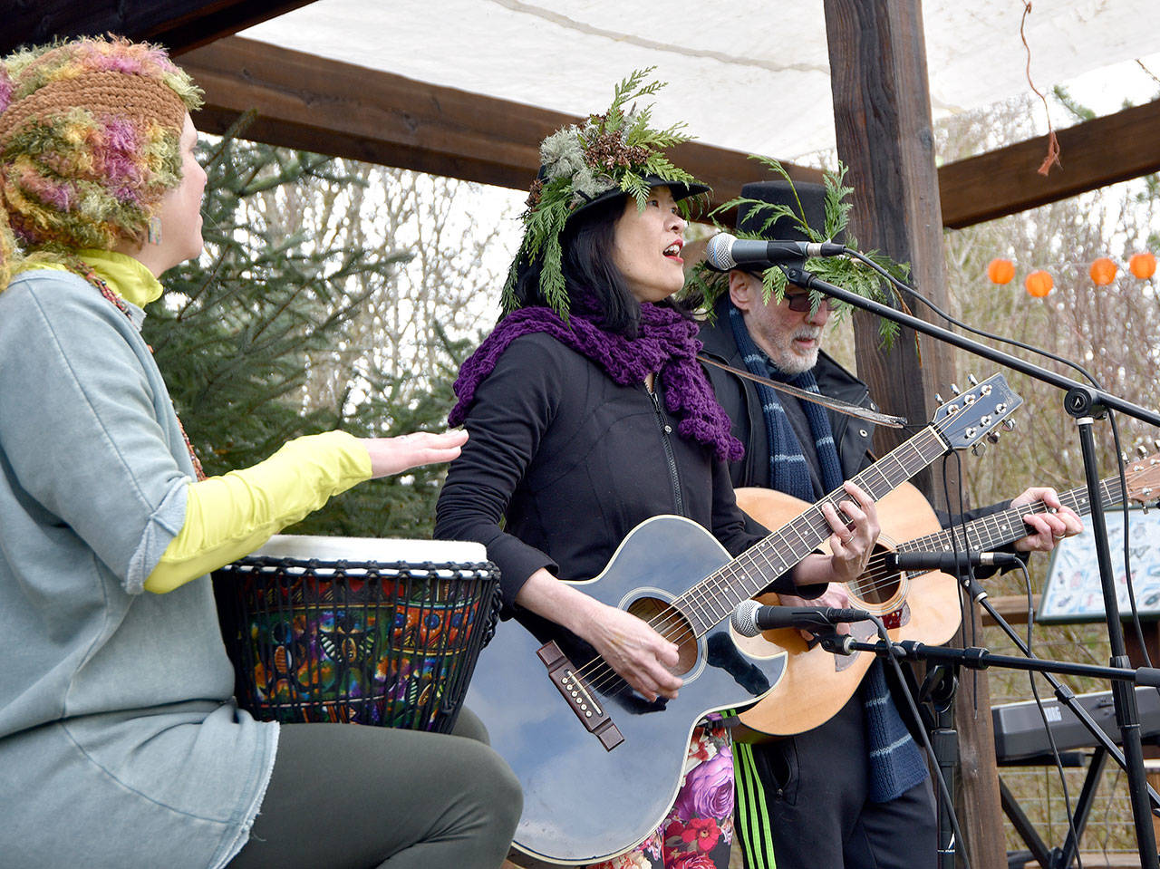 Maren von Nostrand accompanies Joan and Michael Shure during a musical performance in Depot Park following the March of the Vegetables parade.                                Carol Ladwig/Staff Photo