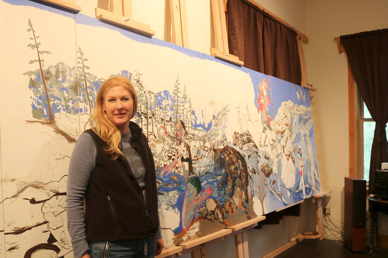 Kristen Lockwood is working on large mural featuring outdoor activities for the Opstad Elementary School gym. She plans to have the mural complete by October. (Evan Pappas/Staff Photo)