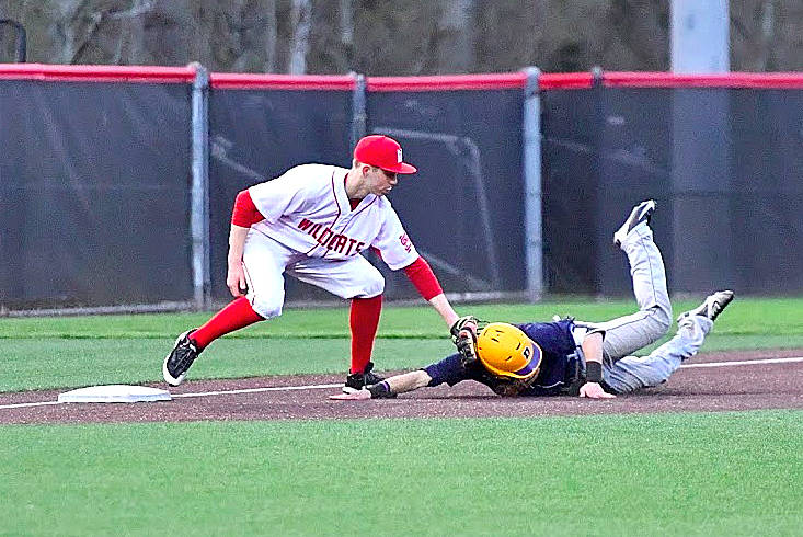 Will Scott tags his opponent for an out in the 9-7 Mount Si win Saturday.                                Photo courtesy of Calder Productions