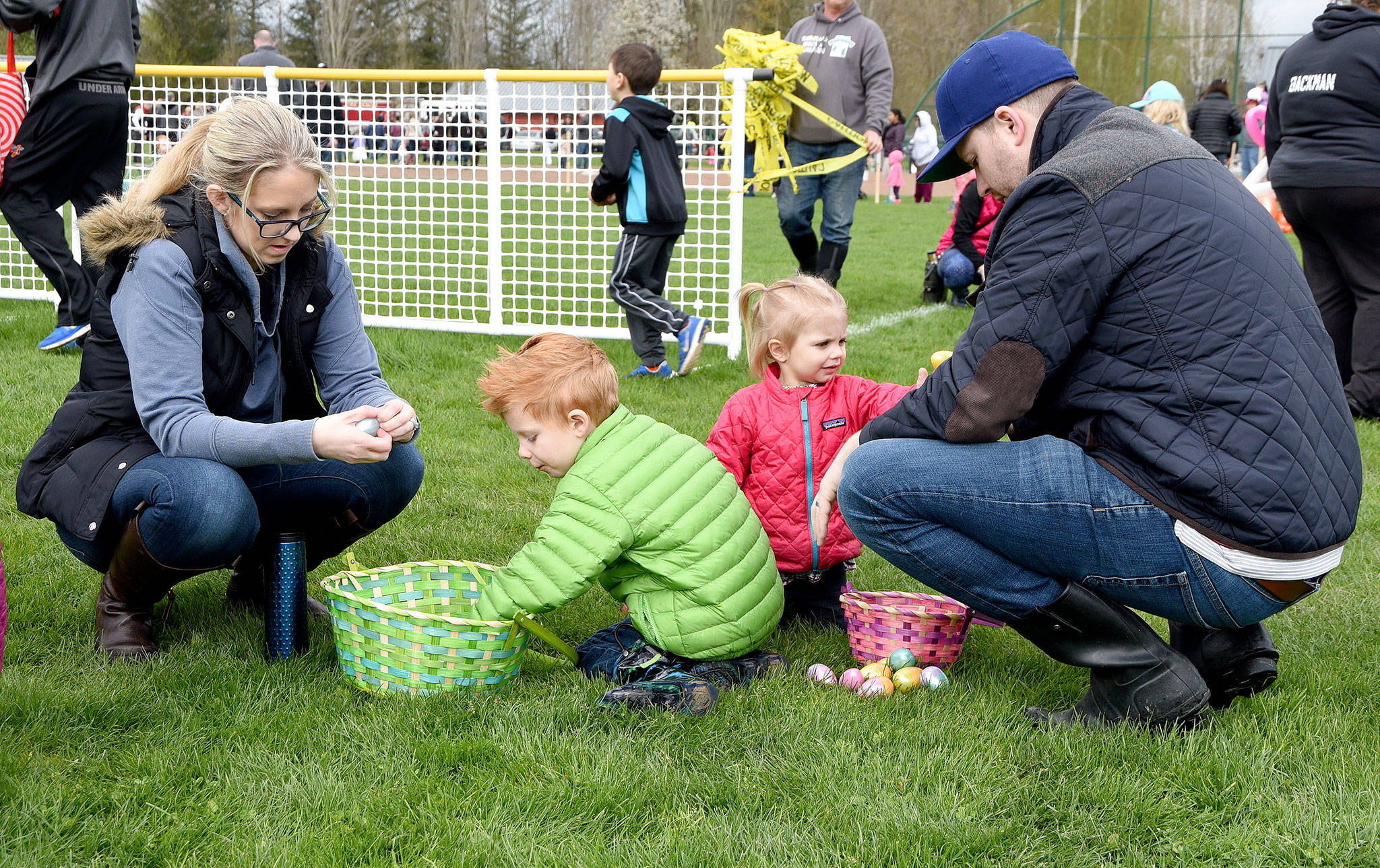 The Kimball family, Brittany, Tucker, age 4, Penelope, age 2 and Leland, had a successful egg hunt, with many eggs to crack open after all the excitement. Carol Ladwig/Staff Photo