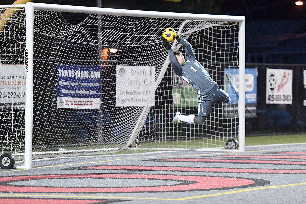 Goalie AJ Zanas makes a big save near the end of the game against Inglemoor. (Photo courtesy of Calder Productions)