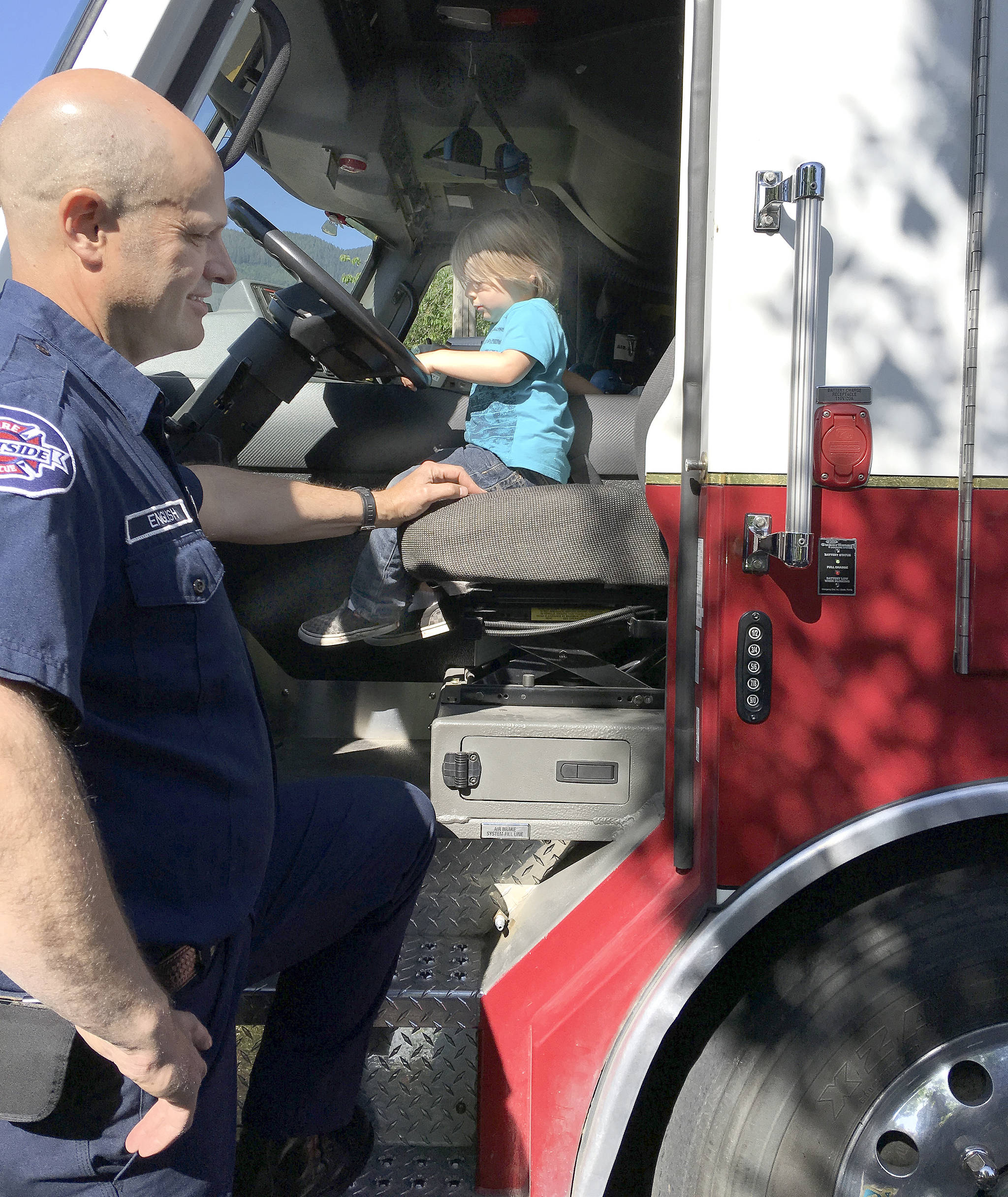 Courtesy Photo                                Children can explore the ladder trucks and other emergency vehicles Friday morning during the Snoqualmie Valley Indoor Playground’s annual Safety Fair.