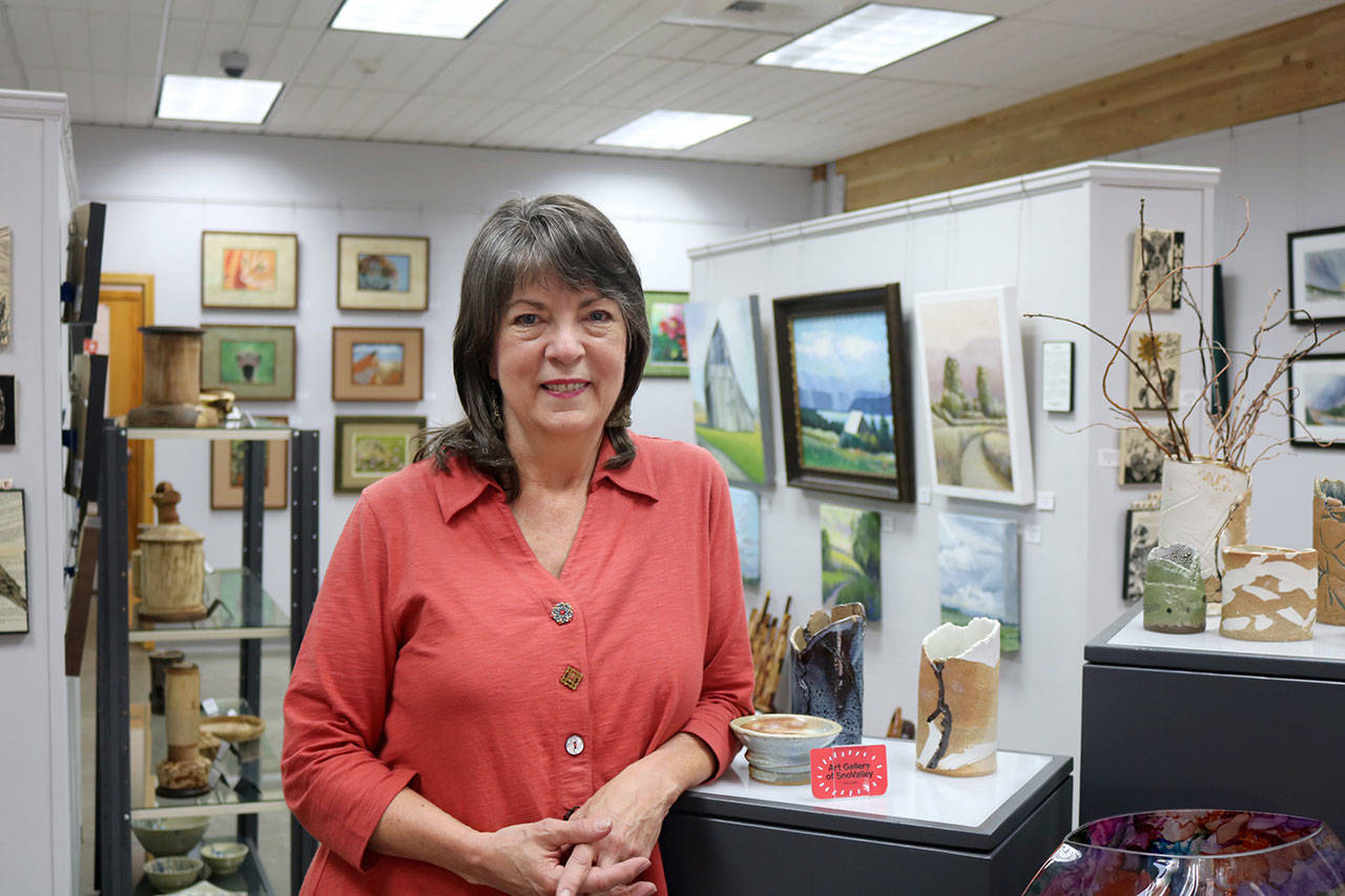 Sally Rackets, a member of the Mount Si Artist Guild collective, helped the group apply to become the interim visitor information center for the city of Snoqualmie this summer. (Evan Pappas/Staff Photo)