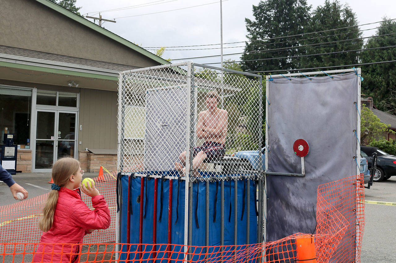 A Raging River Rider and pony follow up the horses in the club’s parade entry.                                Carol Ladwig/Staff Photo                                Another crowd favorite, the dunk tank returned to Fall City Day Saturday.                                Evan Pappas/Staff Photo