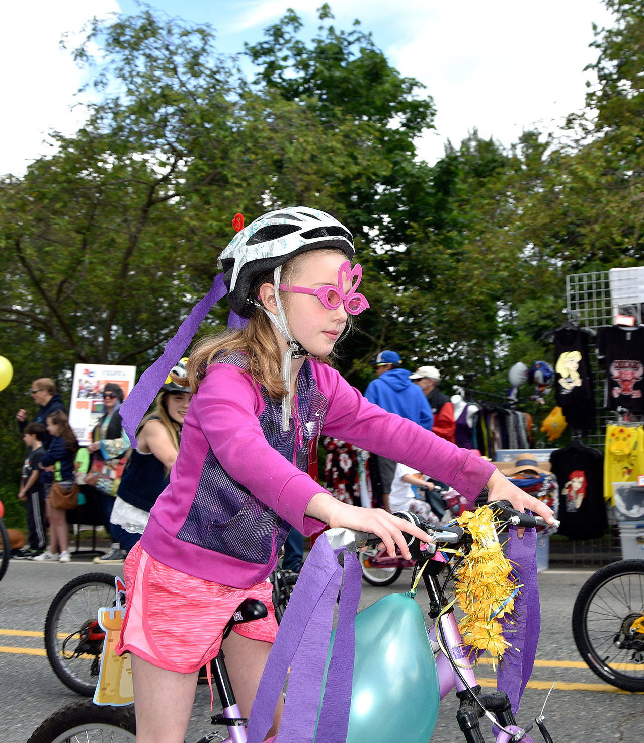 Kids on bikes rode through the Fall City Day parade in a variety of costumes. (Carol Ladwig/Staff Photo)