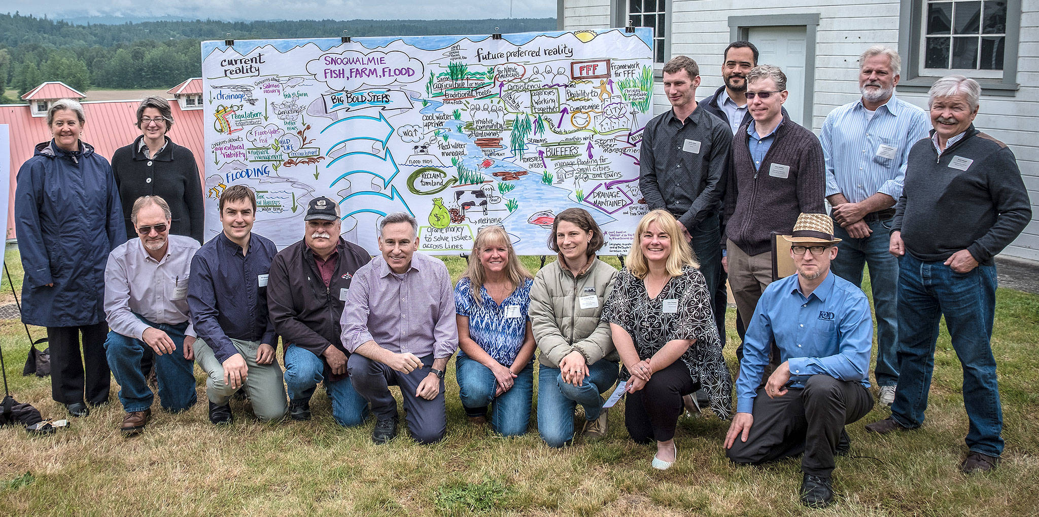 Celebrating the completion of a three-year effort to develop recommendations for protecting wildlife, the watershed and agriculture, King County Executive Dow Constantine and members of the Fish, Farm, Flood committee took a group photo.                                Photo courtesy of Eli Brownell