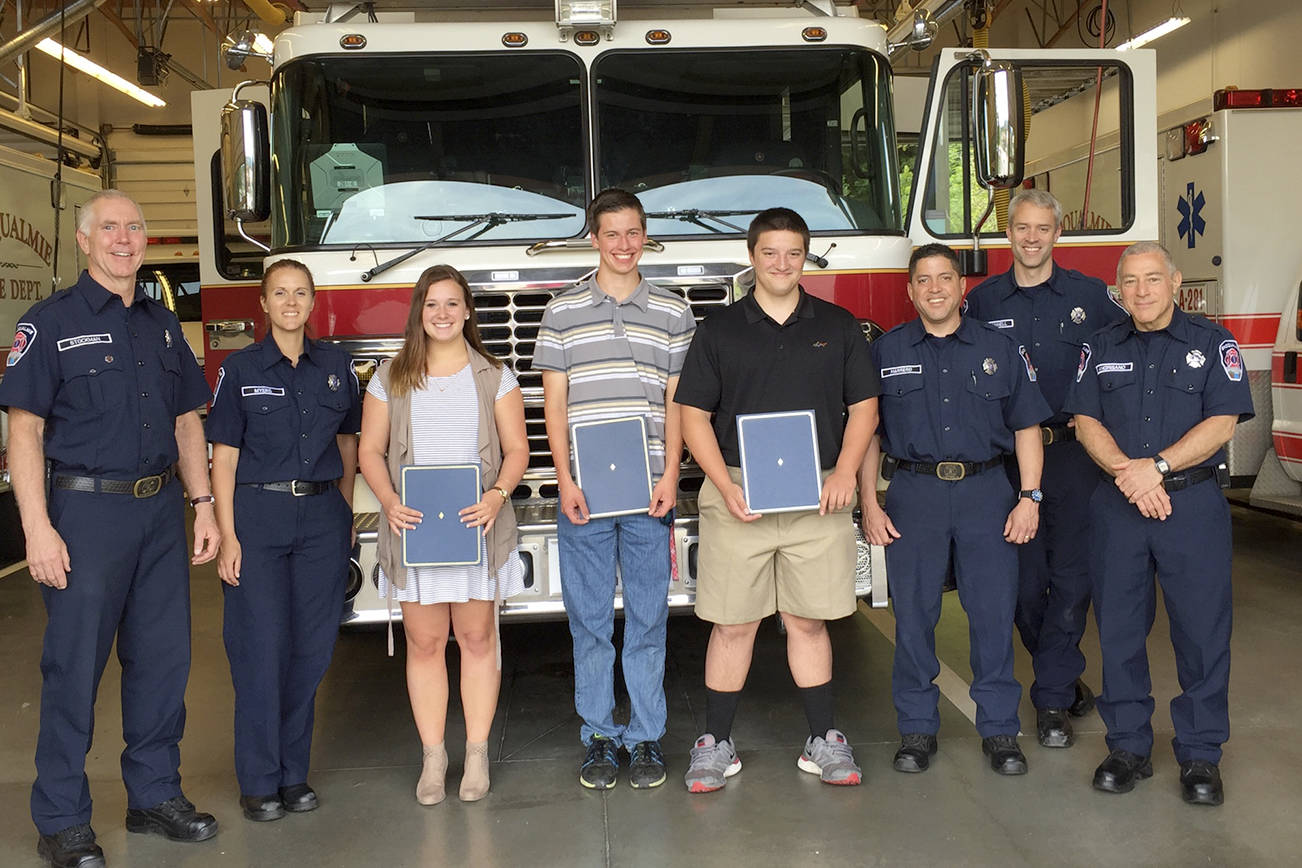 The Snoqualmie Firefighters Association awarded scholarships to three Mount Si seniors last week. Pictured from left are scholarship committee members Steve Stockman and Kristina Myers, scholarship recipients Graysen Kaess, Jake Bailey, Thomas Schuett, Association President Paul Marrero, member Peter O’Donnell, and Robert Angrisano, association Vice President.                                (Courtesy Photo)