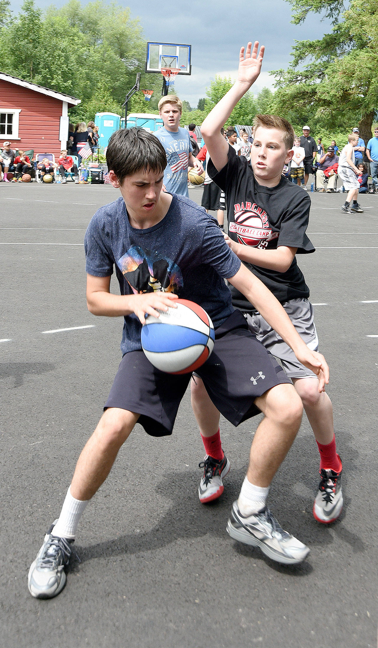 Boys play in the Just Moo It! 3 on 3 basketball tournament in 2016.                                File Photo