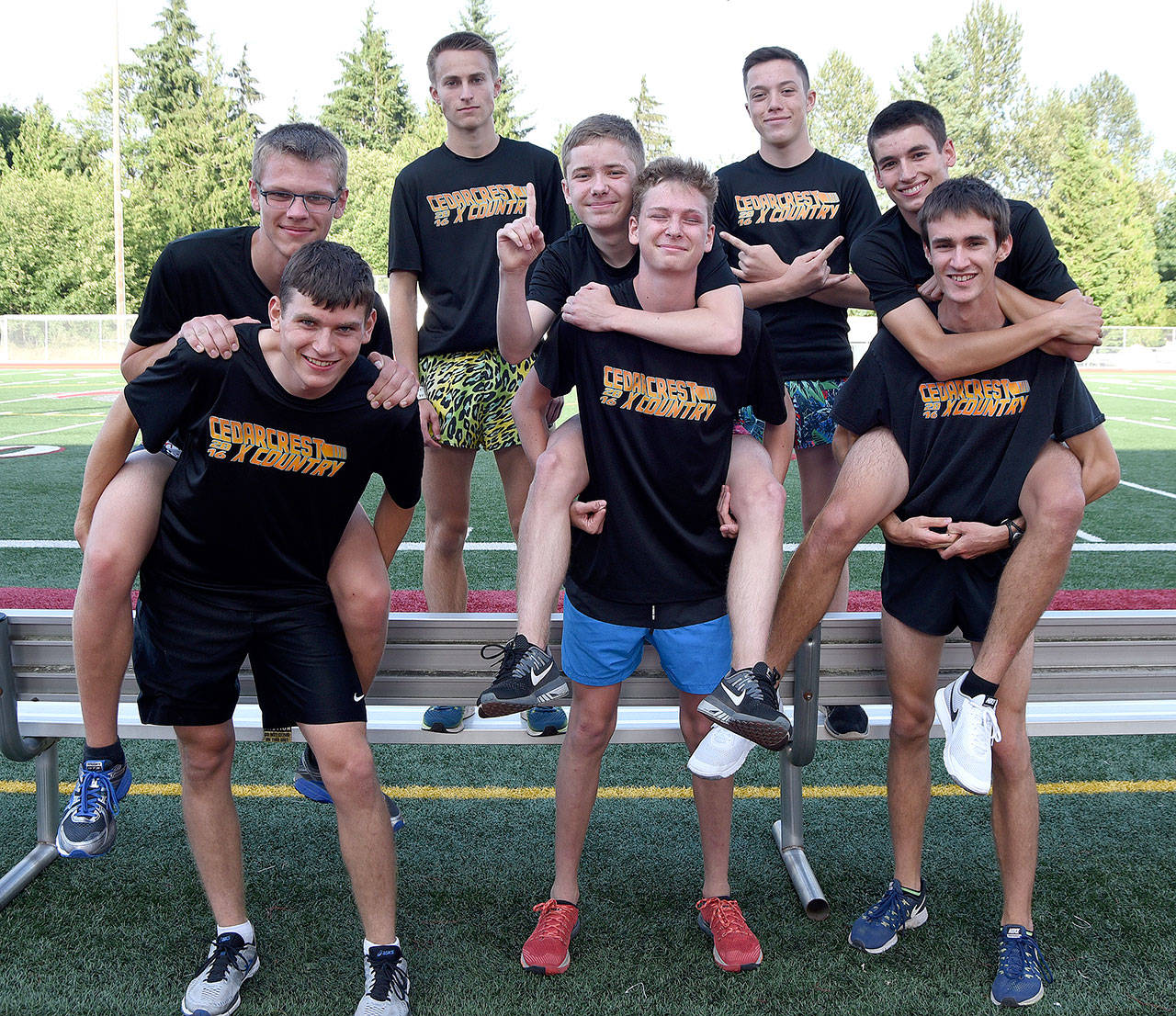 Friends and cross country runners clown around before the start of their two-hour marathon attempt. From left: front - Ben Benson, Emmett Klaiber, Grant Van Valkenburg; middle - Patrick McCabe, Daniel Murphy and Chase Bolin; back- Ian Fay and Ryan LaTurner. Carol Ladwig/Staff Photo