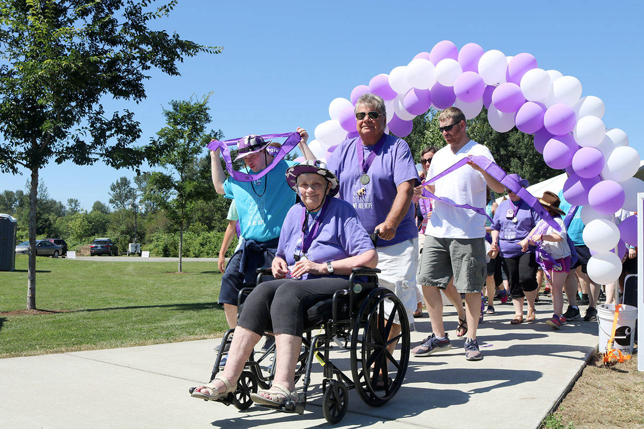 Bev Jorgensen leads the pack during the first walk around Tollgate Farm Park of the day. (Evan Pappas/Staff Photo)