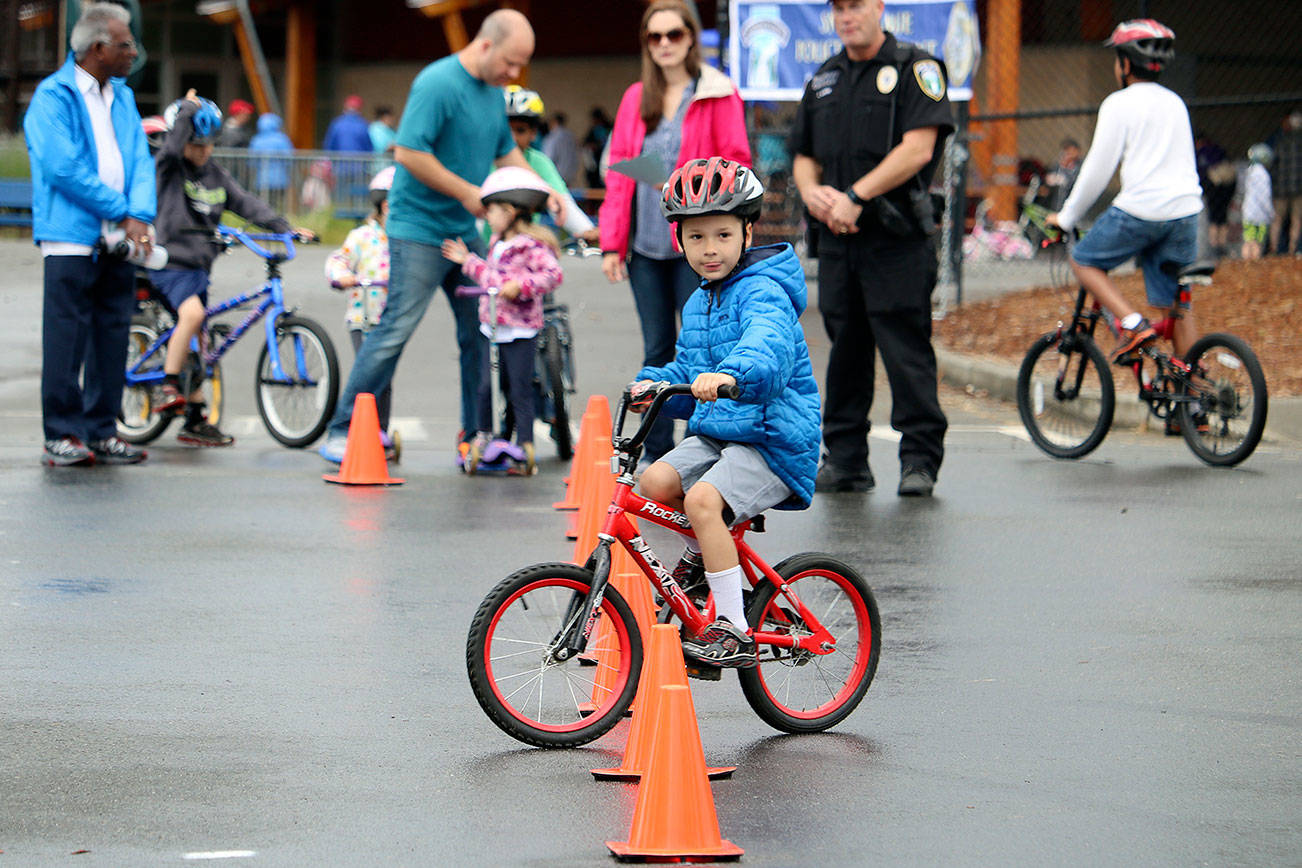 A youngster navigates the obstacle course at the 2016 Bike Rodeo.                                (Evan Pappas/File Photo)