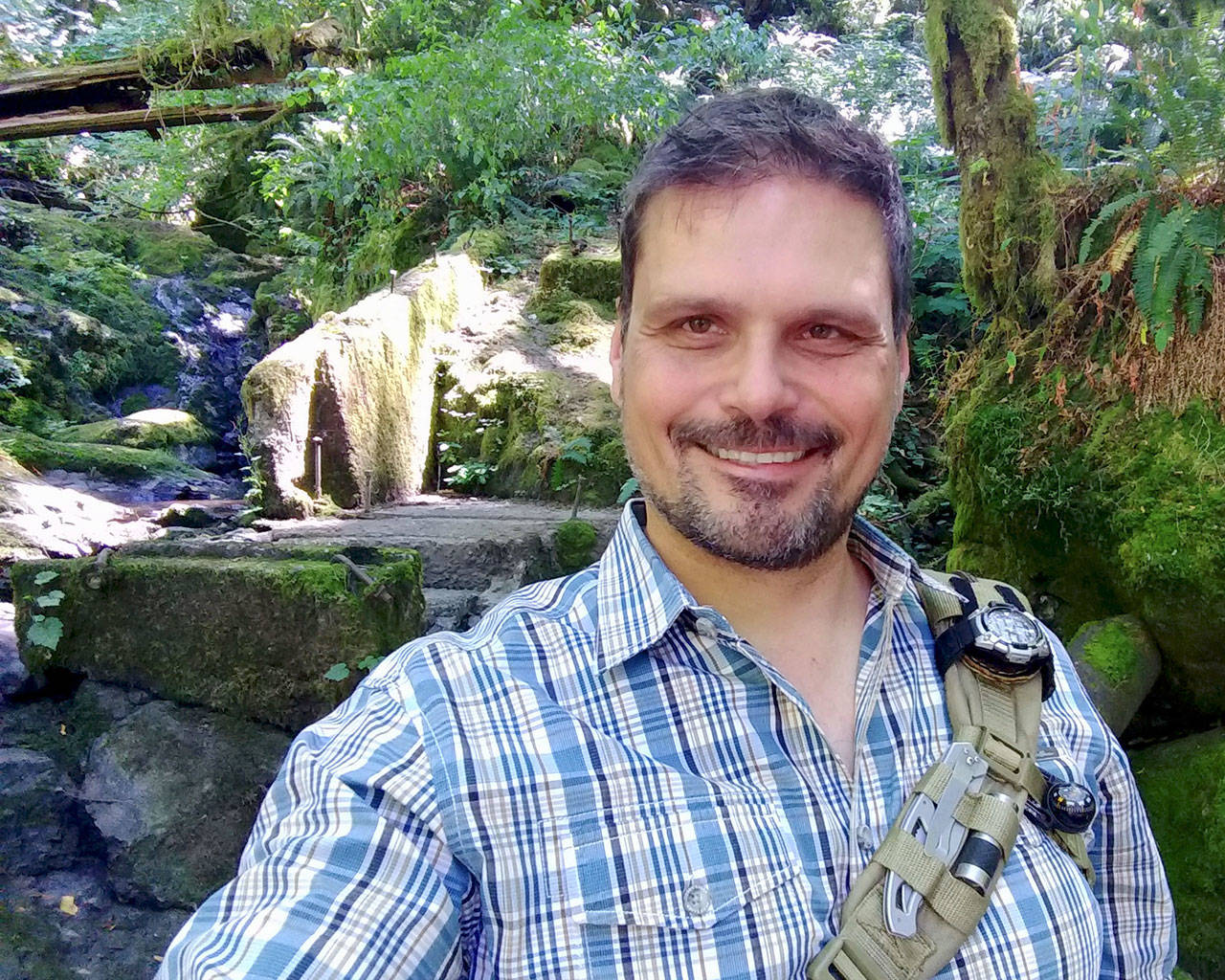 Author James Szubski on a trail by the Tokul Creek Canyon. Szubski blended a real hiking guide and fictional stories to create a unique guide to the Snoqualmie Valley. (Courtesy Photo)