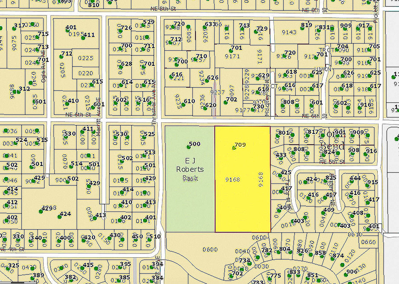 North Bend has reached a purchase agreement for a five-acre parcel of land, highlighted in yellow on this map, next to E.J. Roberts Park. Half the parcel will be used for a single-family home and the other half will either be added to to the park, or to adjoining lots.                                (Courtesy image)