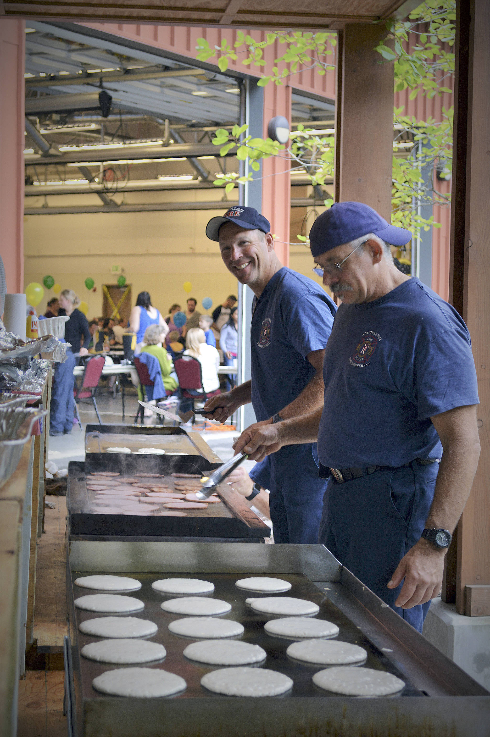 File Photo                                Firefighters cooking up pancakes at the 2016 Pancake Breakfast.