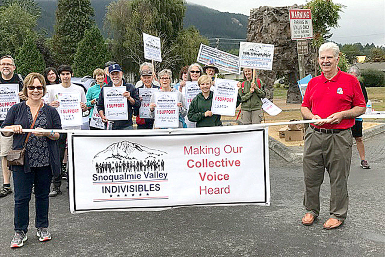 The Snoqualmie Valley Indivisibles march behind their banner at the Festival at Mount Si.                                (Courtesy Photo)