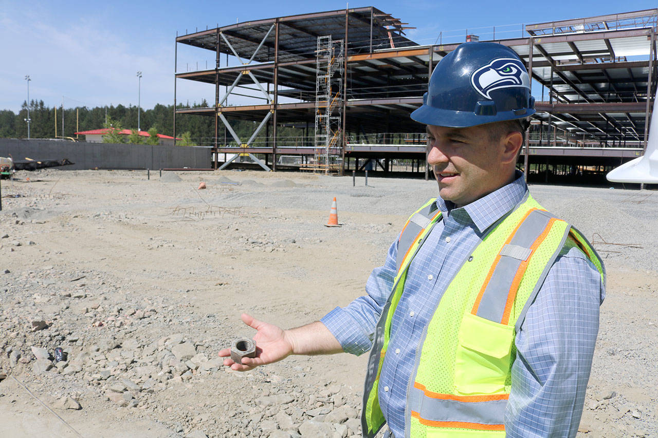 Assistant Superintendent Ryan Stokes leads a tour of the Mount Si High School construction project last week.                                (Evan Pappas/Staff Photo)