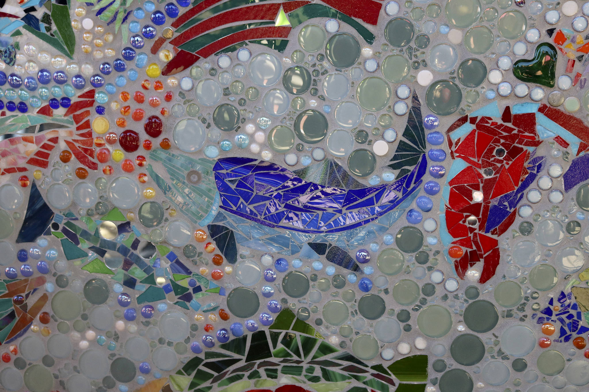 Sammamish glass artist Cheryl Smith provided recycled pieces of stained glass and fish templates, but community members made each fish their own. Nicole Jennings/staff photo