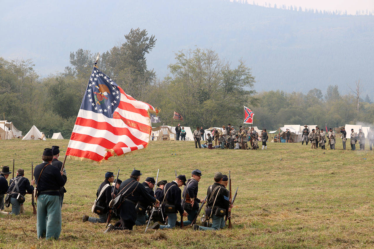 Union and Confederate soldiers begin firing shots at each other during the third annual Civil War re-enactment, The Battle of Snoqualmie, held on Saturday, Sept. 16, at Meadowbrook Farm. (Evan Pappas/Staff Photo)