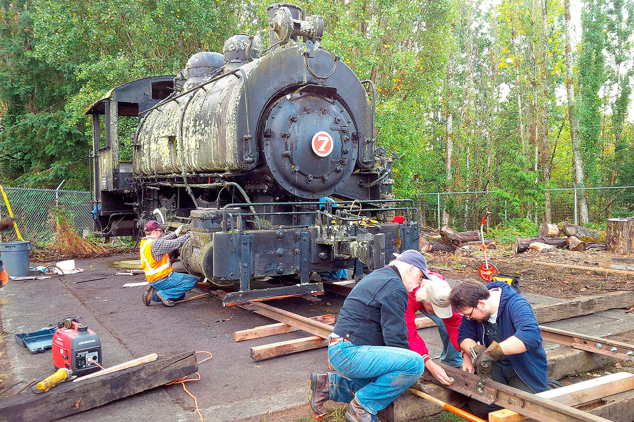 Volunteers work on a makeshift trackfor the steam locomotive that the Northwest Railway Museum acquired in September from the city of Bellingham. (Courtesy Photo)
