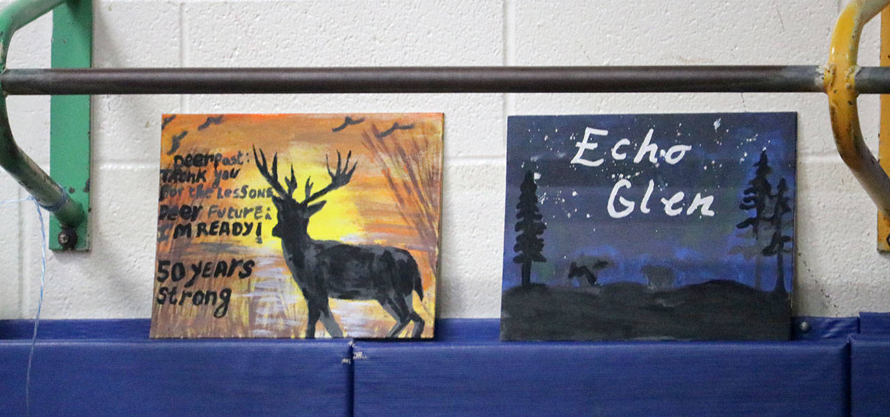 Paintings done by Echo Glen residents lined the walls of the gym at the event. (Evan Pappas/Staff Photo)