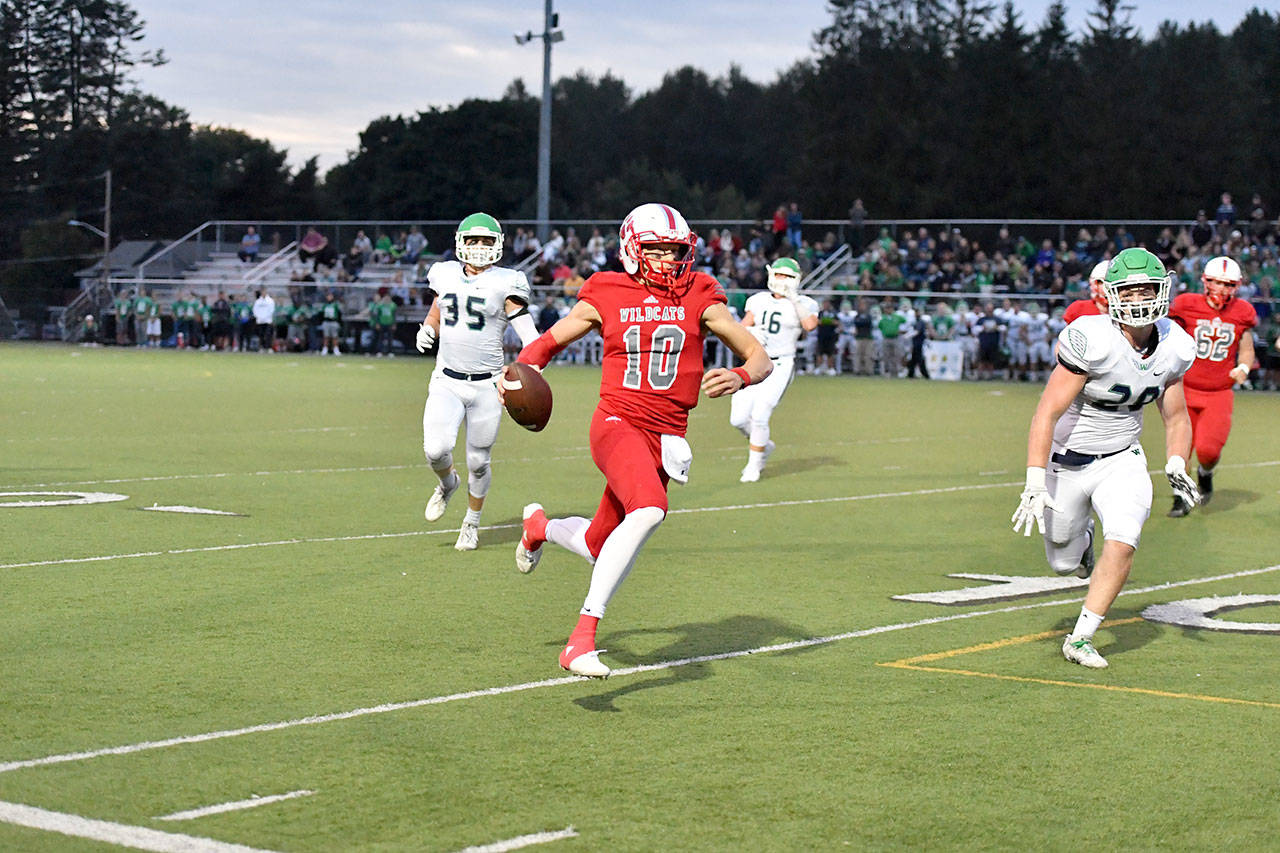 Quarterback Cale Millen pushes up the ball before Mount Si’s first and only touchdown of the night. (Photo courtesy of Calder Productions)