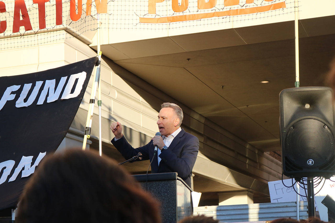 King County Executive Dow Constantine tells President Trump that he is “failing the American people” at the protest of U.S. Secretary of Education Betsy DeVos’ trip to Bellevue on Friday. Nicole Jennings/staff photo
