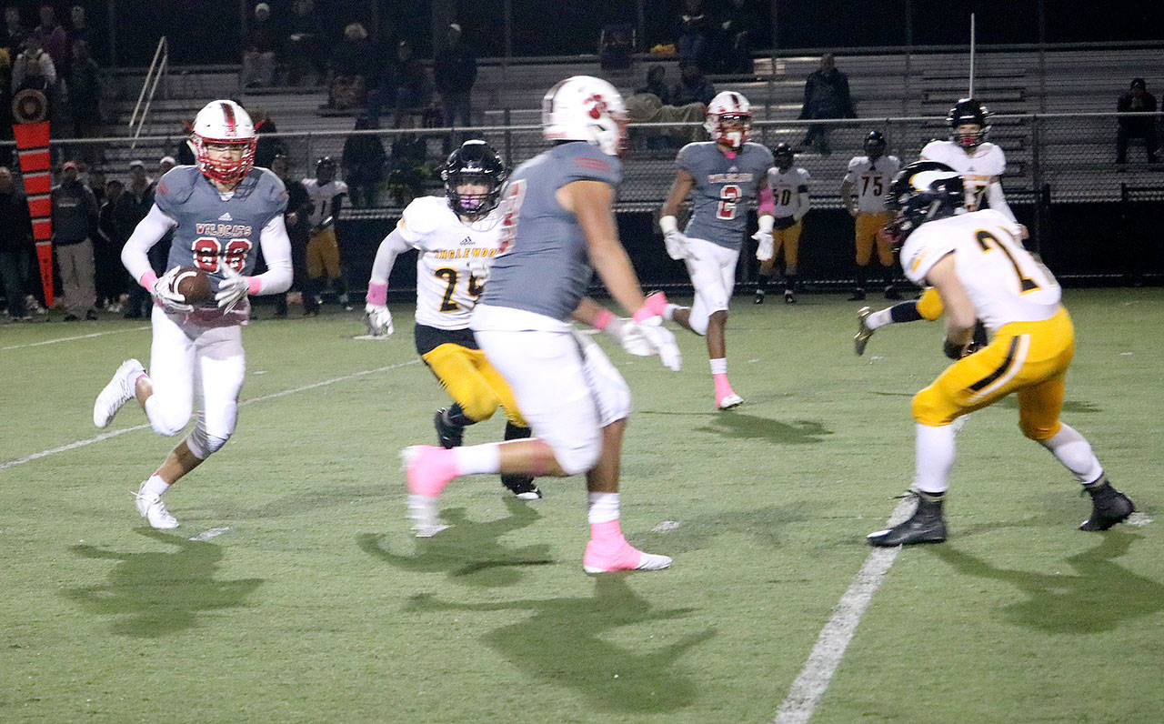 Johnny Barrett carries the ball in Mount Si&rsquo;s Homecoming game Friday against Inglemoor. (Carol Ladwig/Staff Photo)